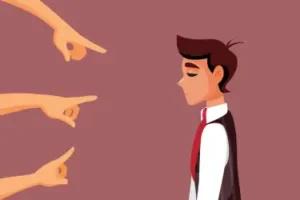 Scapgoating. Scapegoating is the act of blaming an out-group when the frustration of the in-group experience is blocked from obtaining a goal.